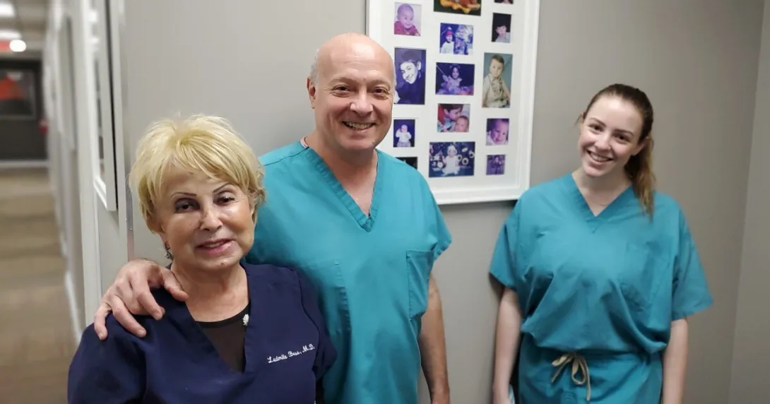 Three smiling medical professionals
