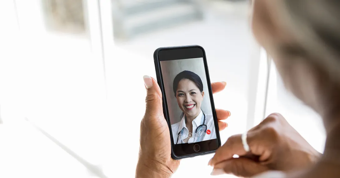 Person attending telehealth appointment on smartphone