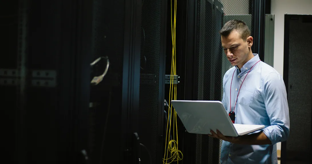 IT worker restores systems in server room IT worker restores systems in server room