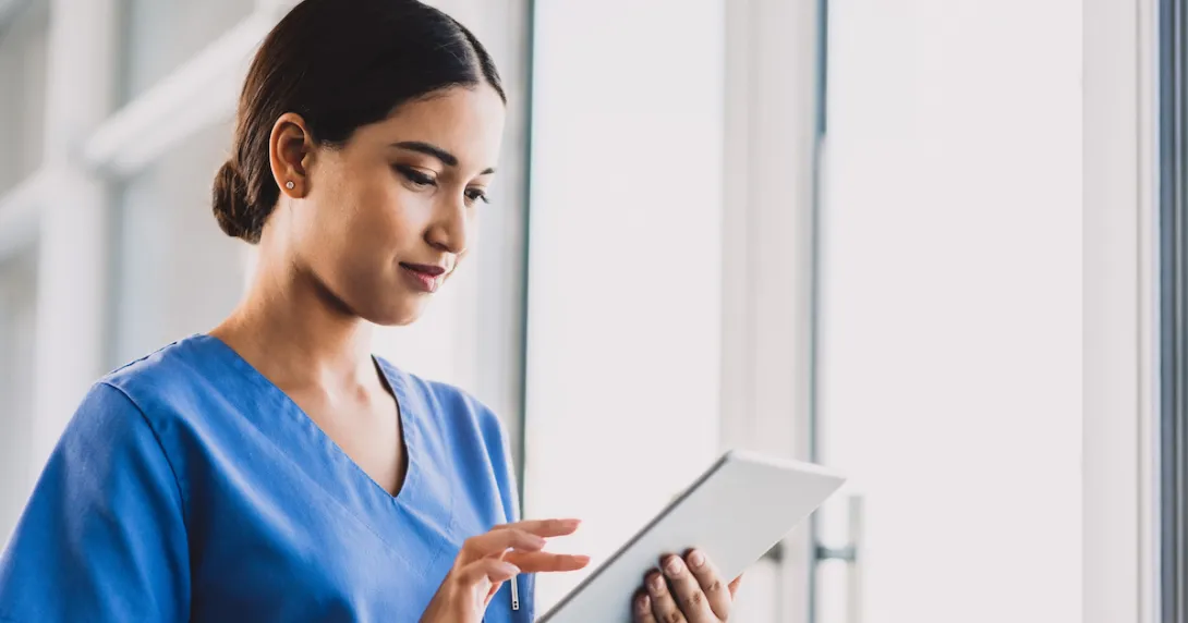 Healthcare worker using tablet