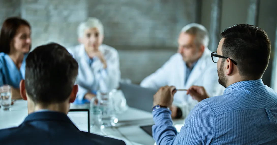 Hospital administrators in a meeting Hospital administrators in a meeting