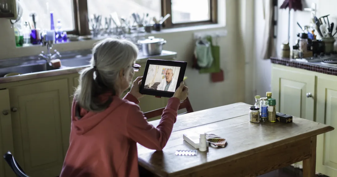 Patient attending telehealth appointment on tablet