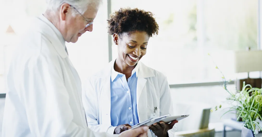 Doctors looking at tablet