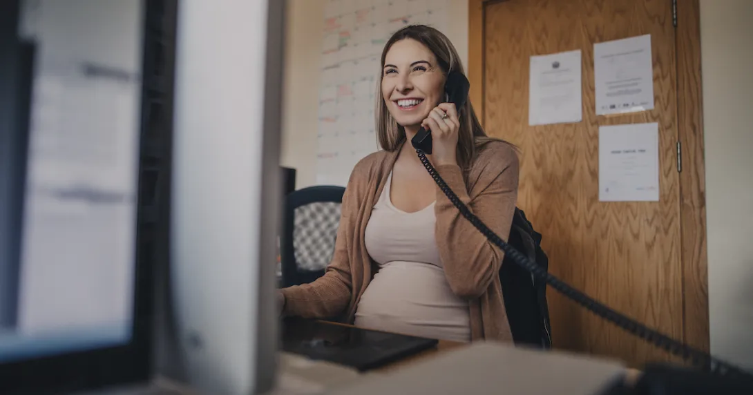 Pregnant person talking on the phone