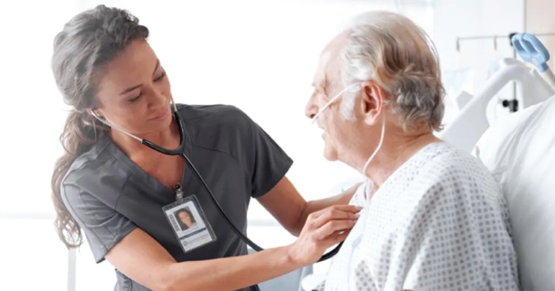 Healthcare worker checking patient with stethoscope