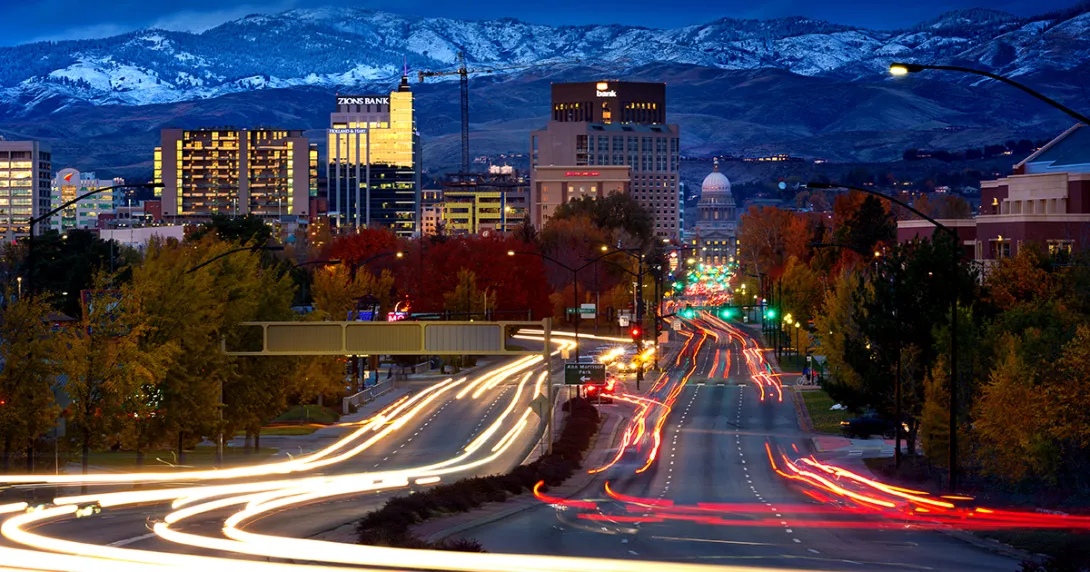 Idaho scene, city buildings below mountain range