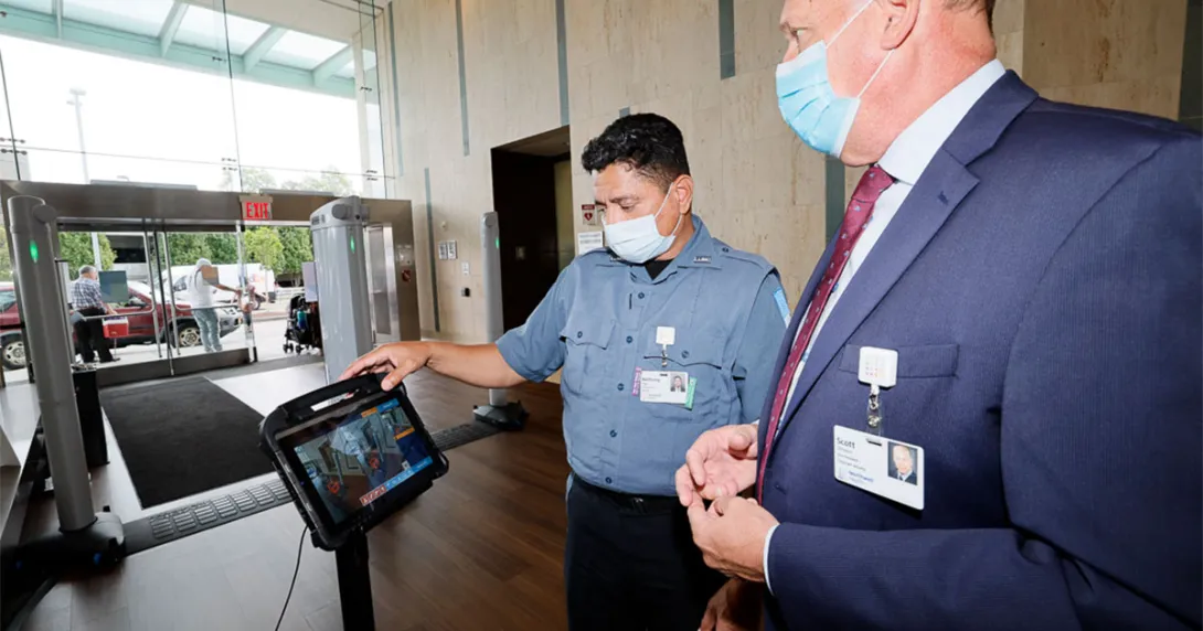 People look at a security screen