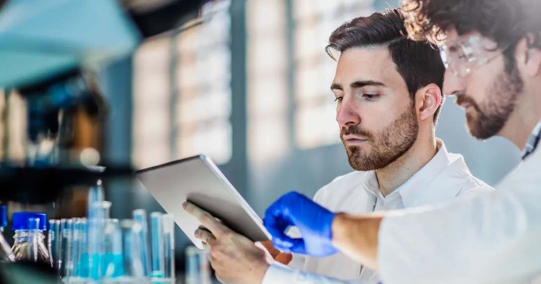 Laboratory workers using tablet