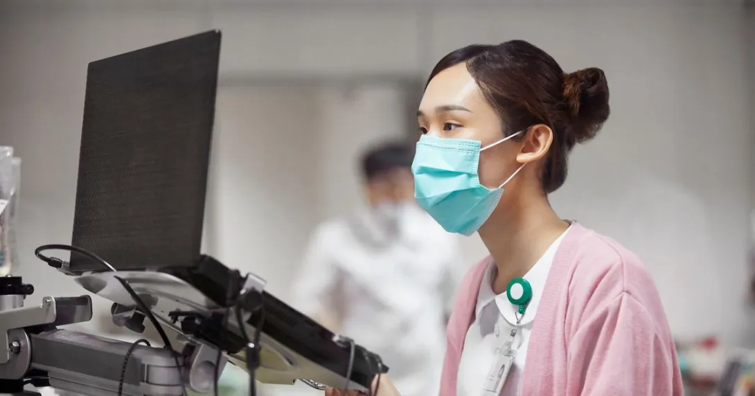 Hospital nurse at a computer Hospital nurse at a computer