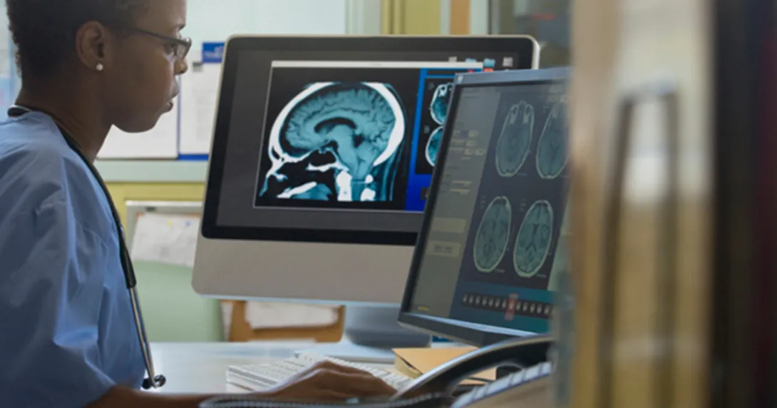 Radiologist looks at PACS monitor