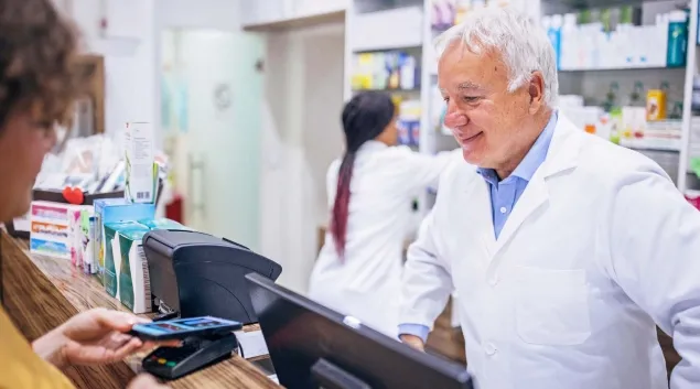 Pharmacist helps a customer