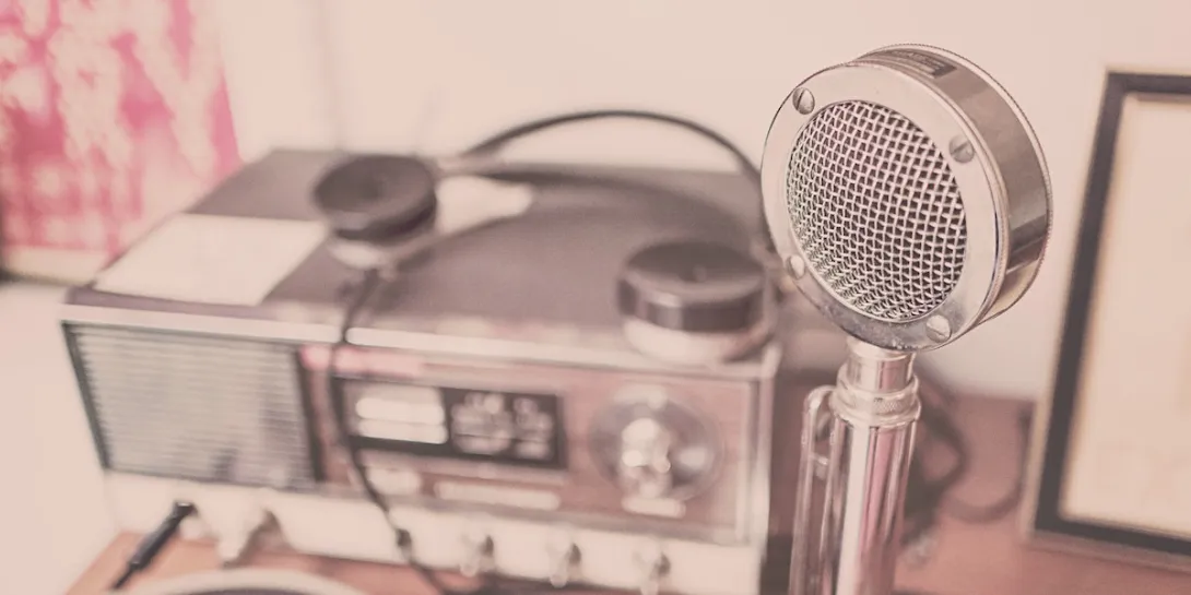 An old-timey microphone and radio setup represent our weekly digital health podcast