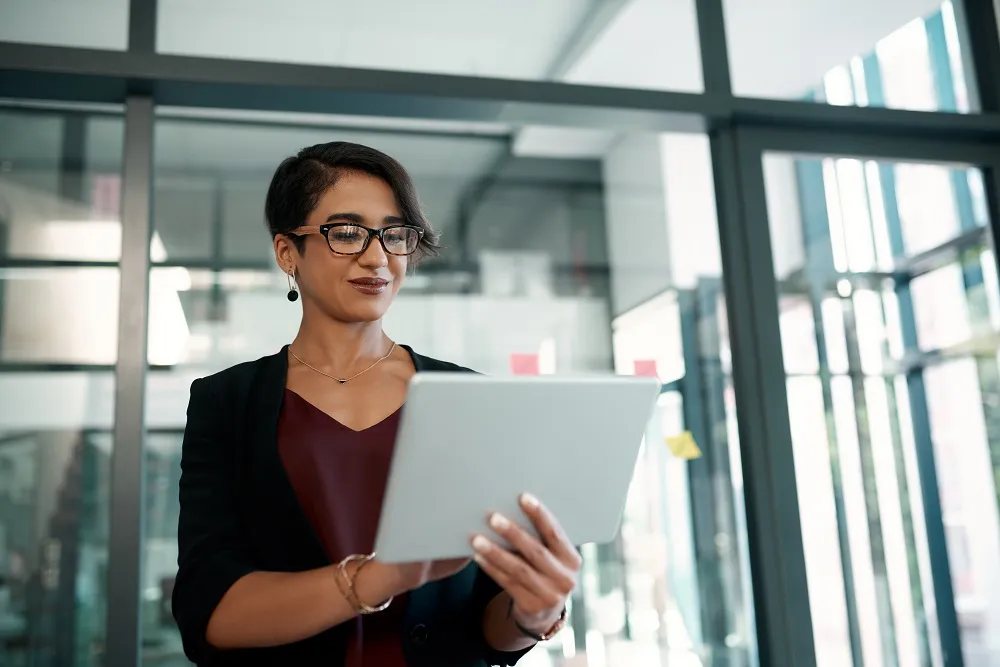 Worker in office using tablet