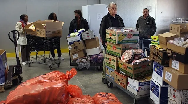 Food pantry workers unloading boxes