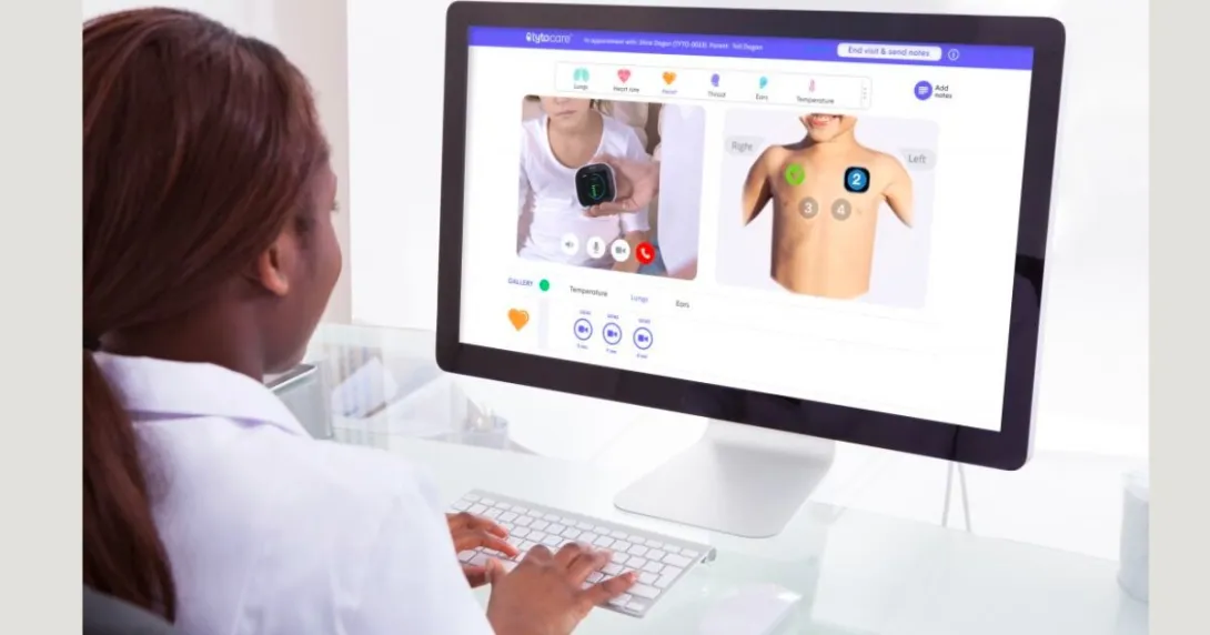 A doctor virtually examining a patient via Tyto Care desktop system.