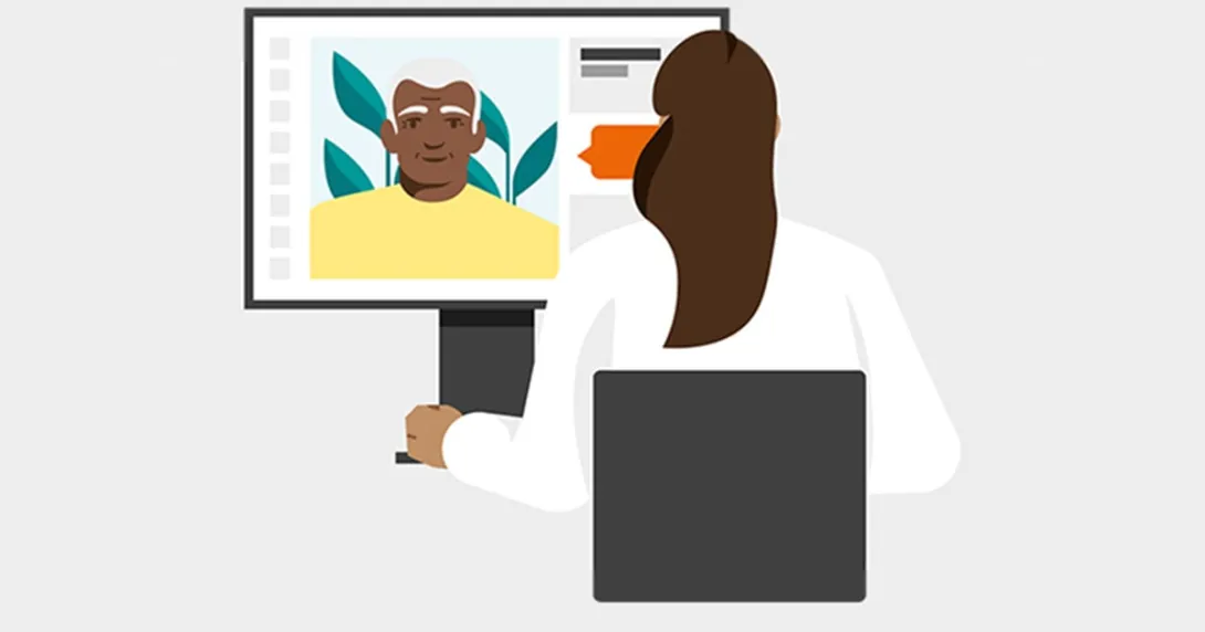Medical worker talking to patient via videochat on a computer screen