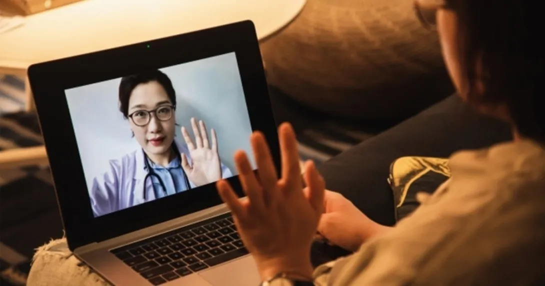 A telehealth consultation via laptop pc