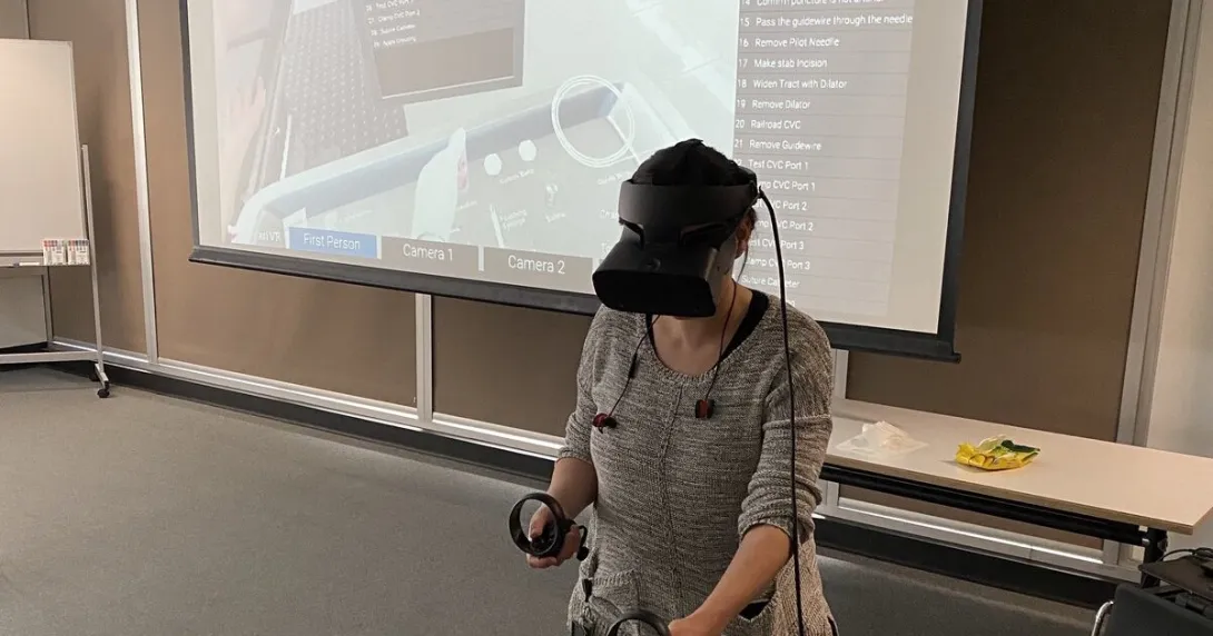 A clinician demonstrating the use of the Vantari VR training platform