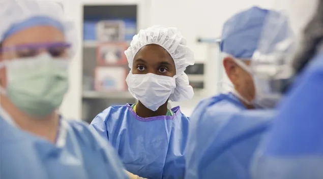 Medical workers in masks and scrubs