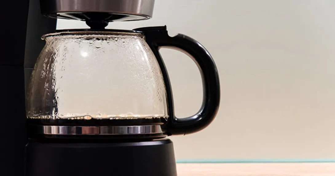 A coffee pot in a machine