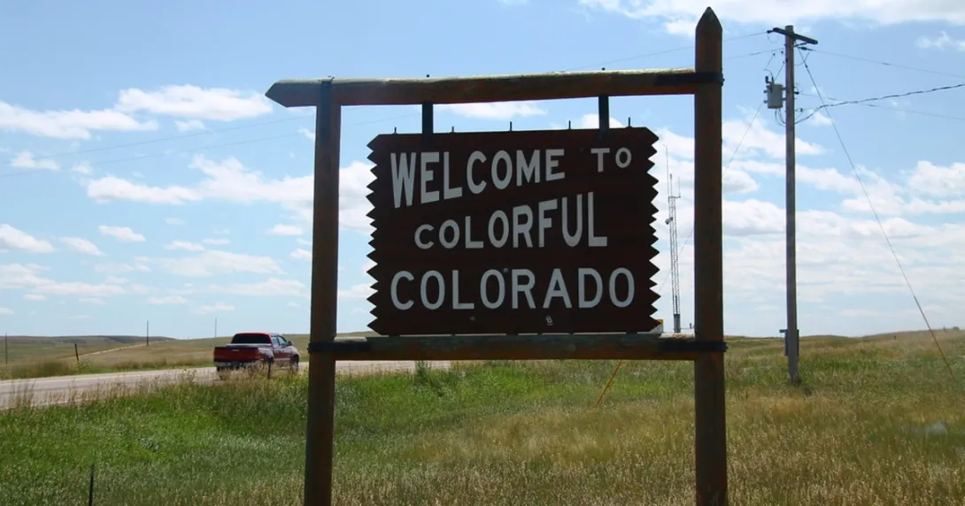 A sign reading "Welcome to Colorful Colorado"