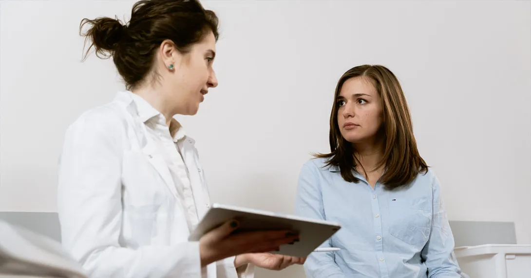 Doctor speaks with patient Doctor speaks with patient