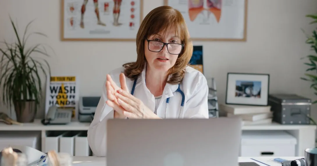 A doctor looking at a computer screen