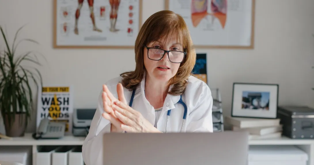 A doctor sitting in front of a computer