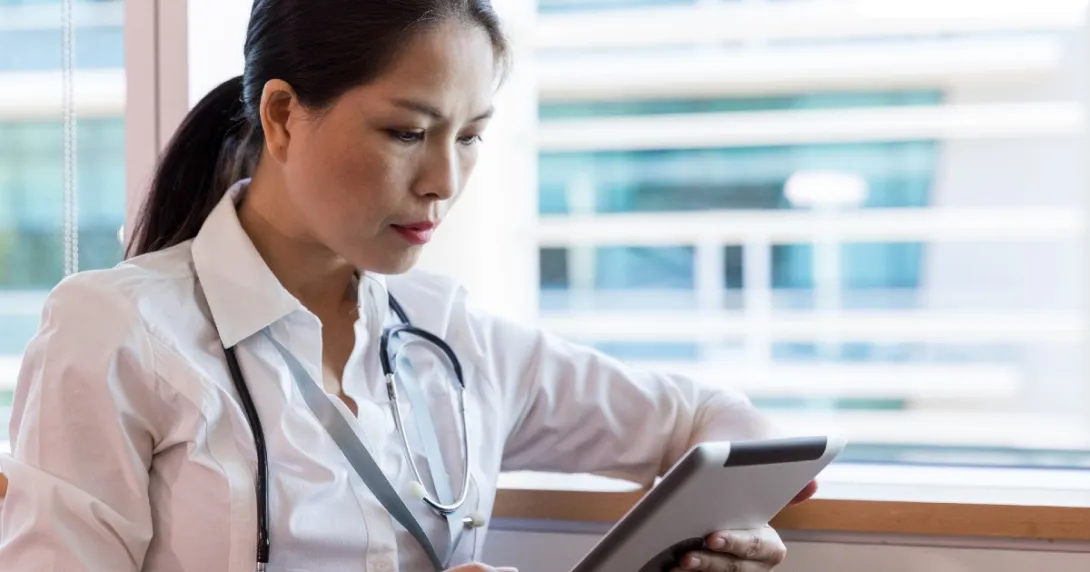 A doctor with a tablet