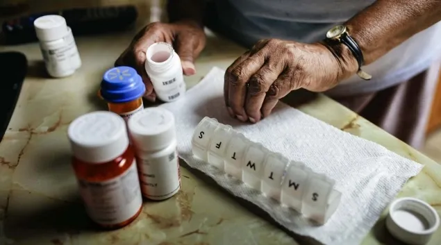 Person organizing pills