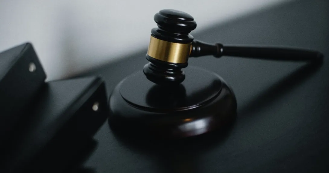 A gavel next to binders
