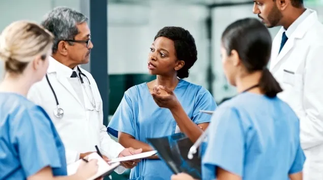 Doctors and other healthcare workers talking