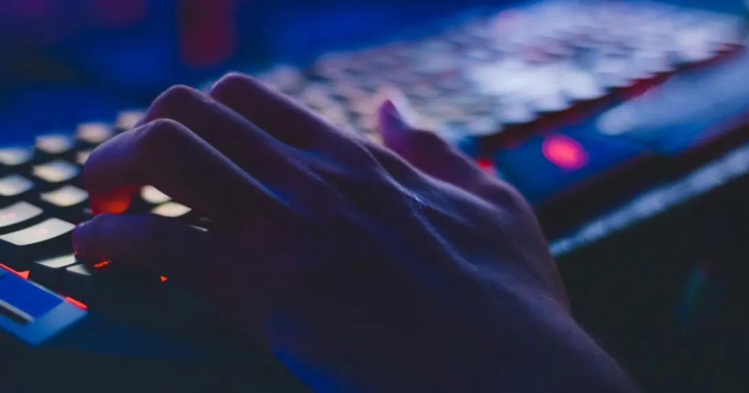 Cybersecurity threat Hand on a keyboard