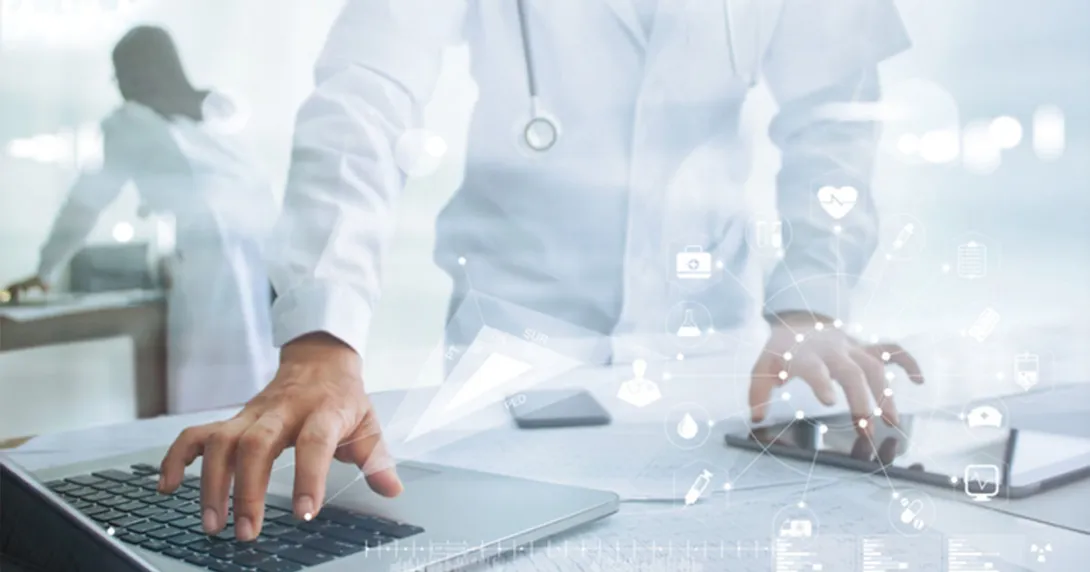 Medical researchers use data to better understand public health and patient outcomes. Healthcare professional with tablet and laptop