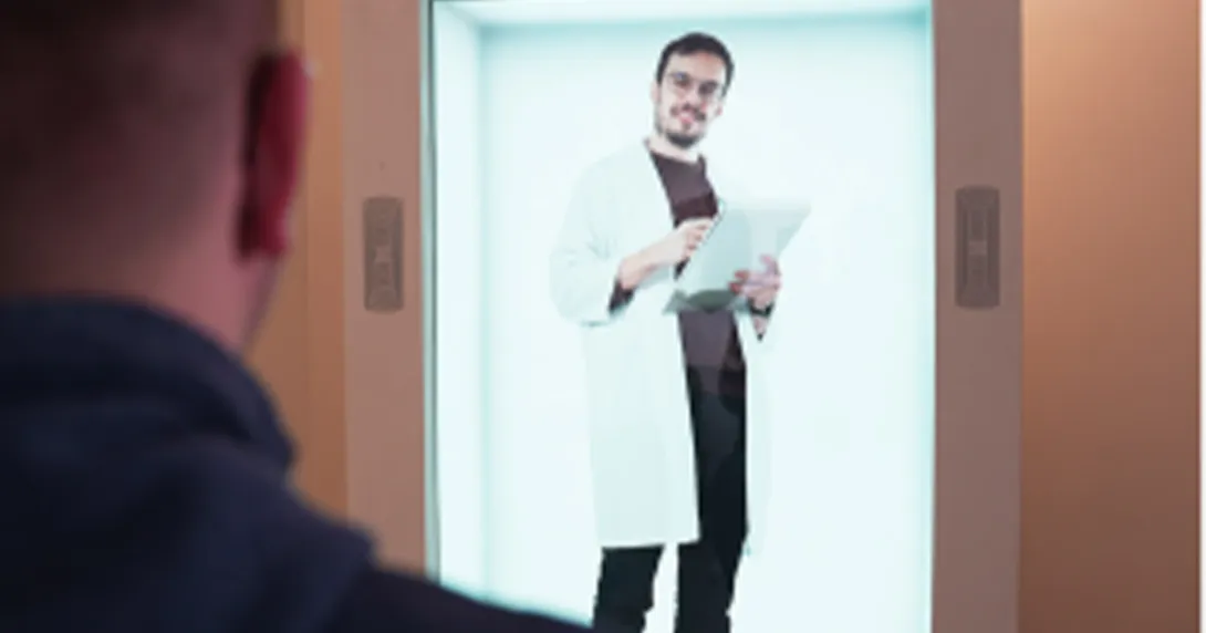 Male doctor appears in a 3D hologram display with a patient in the foreground Male doctor appears in a 3D hologram display with a patient in the foreground