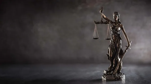 Statuette of Justice holding scales