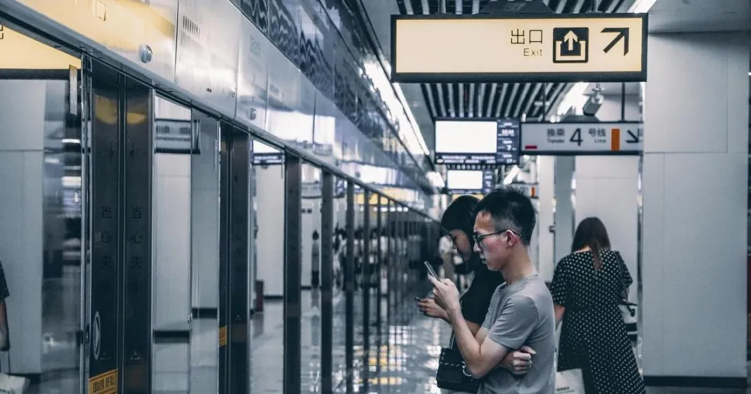 Passengers waiting in line in a subway in China