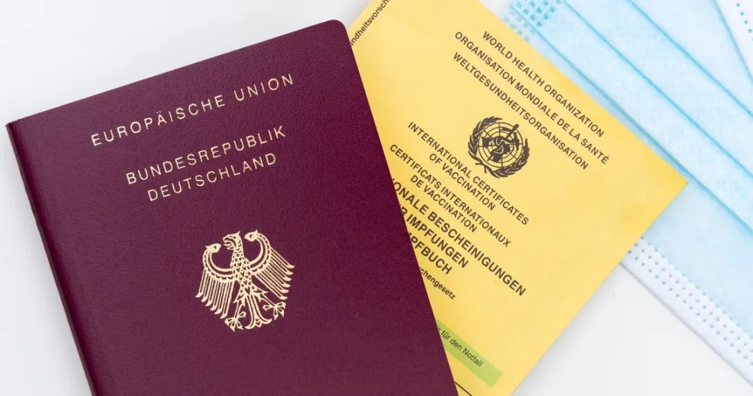 A photo of the WHO yellow card and European Union passport