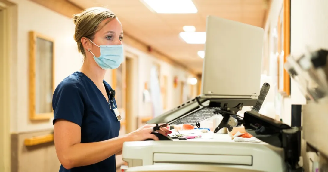 A nurse uses a computer