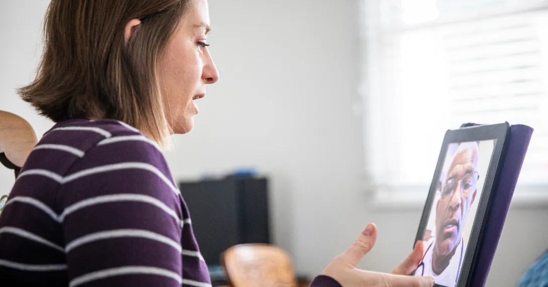 A patient consults with a doctor using telehealth