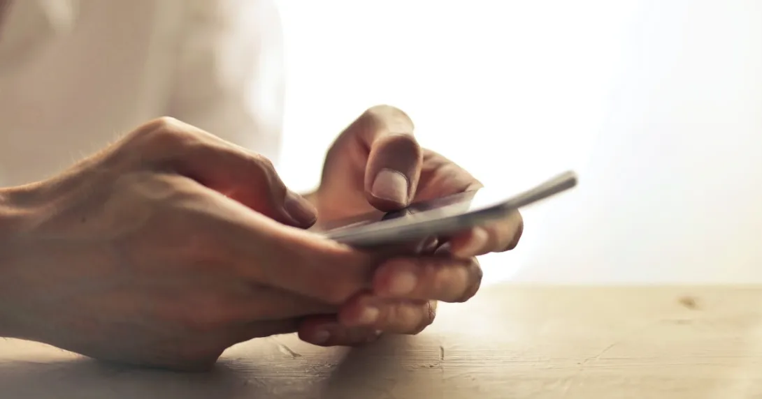 Hands search a mobile phone. Hands search a mobile phone.