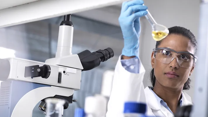 lab worker holding a test tube