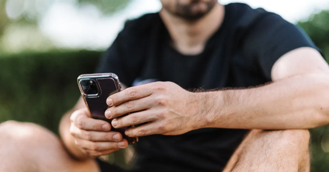 A person holding an iPhone