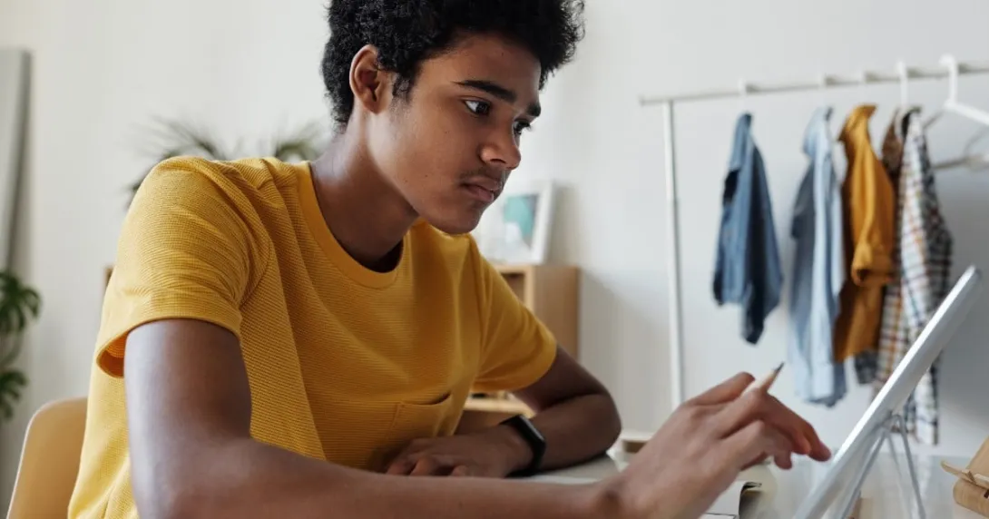 A teen using a computer