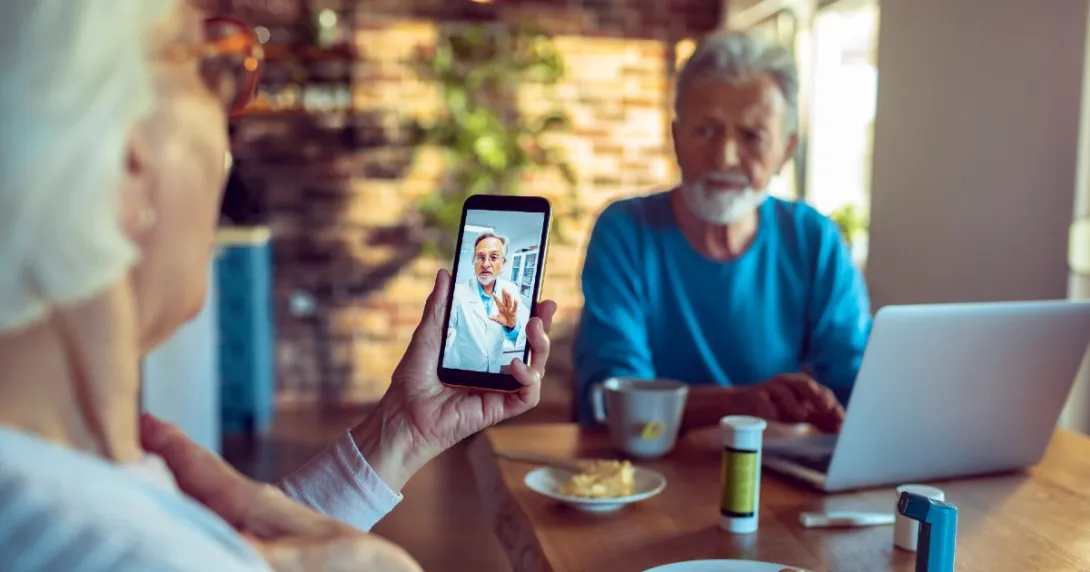Two people consult with a doctor via telehealth Two people consult with a doctor via telehealth