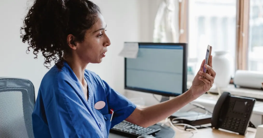 A provider speaking to a patient via telehealth