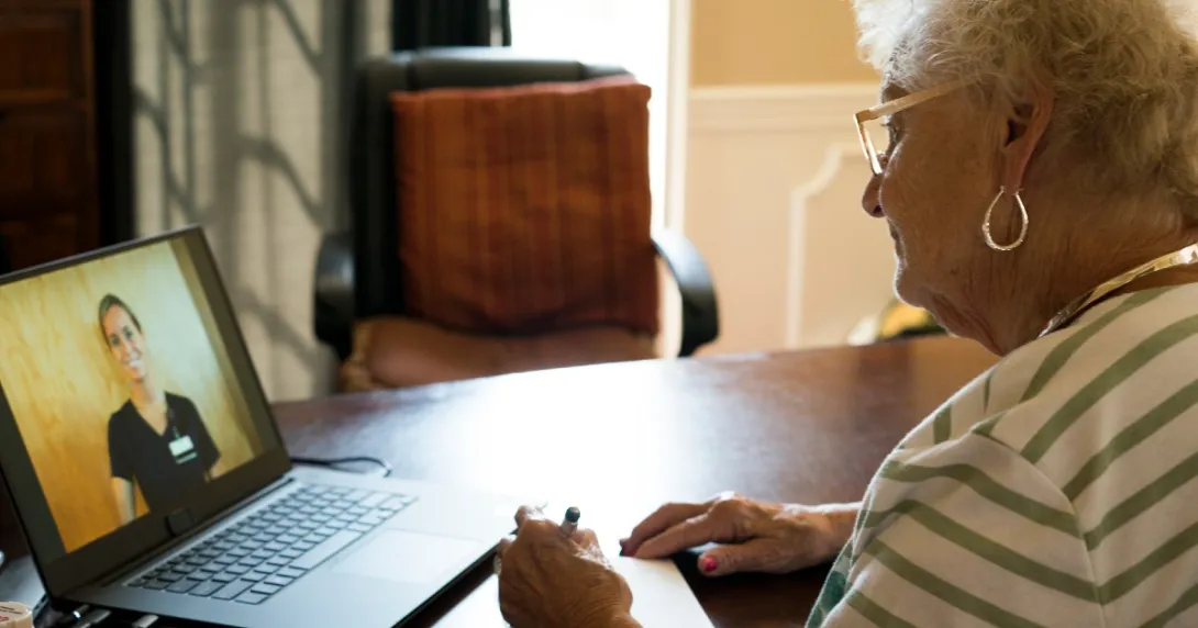 A patient speaks with a nurse via telehealth