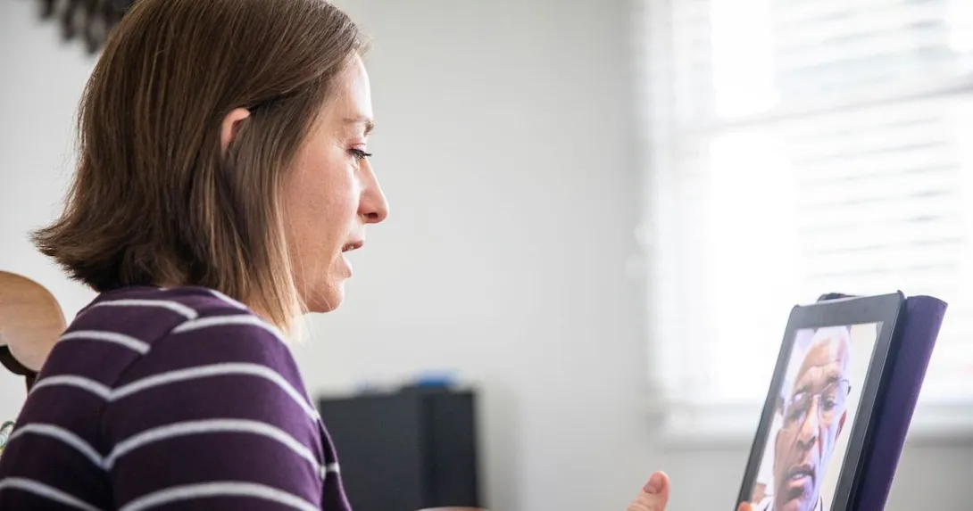 Patient attending telehalth appointment on a tablet