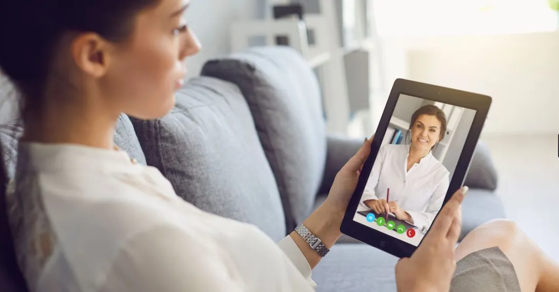 Patient attending telehealth appointment on tablet