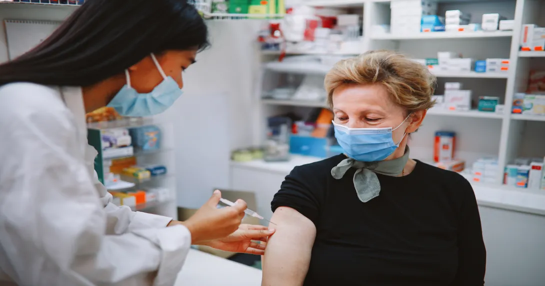 Patient in mask getting vaccine